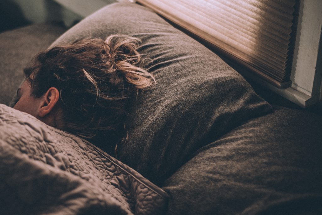 Woman sleeping in a bed
